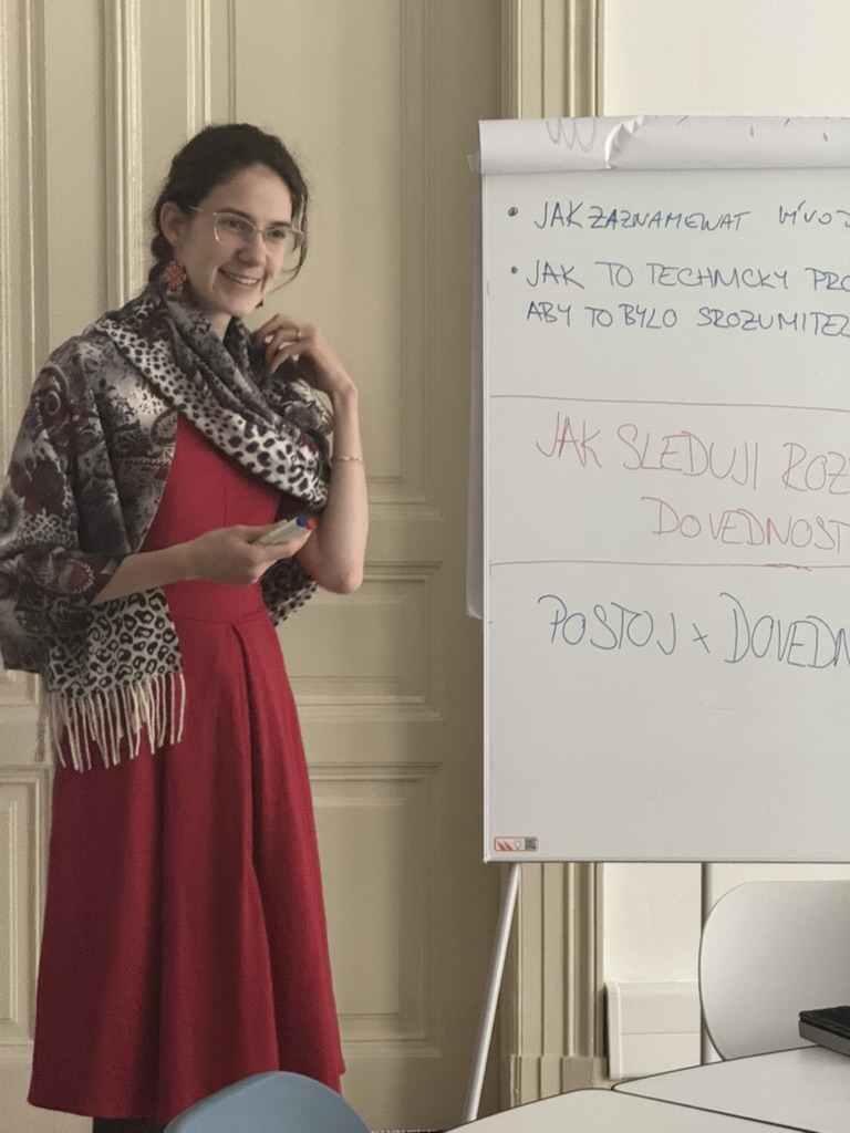 A participant discussing ideas beside a flipchart at the May meetup.
