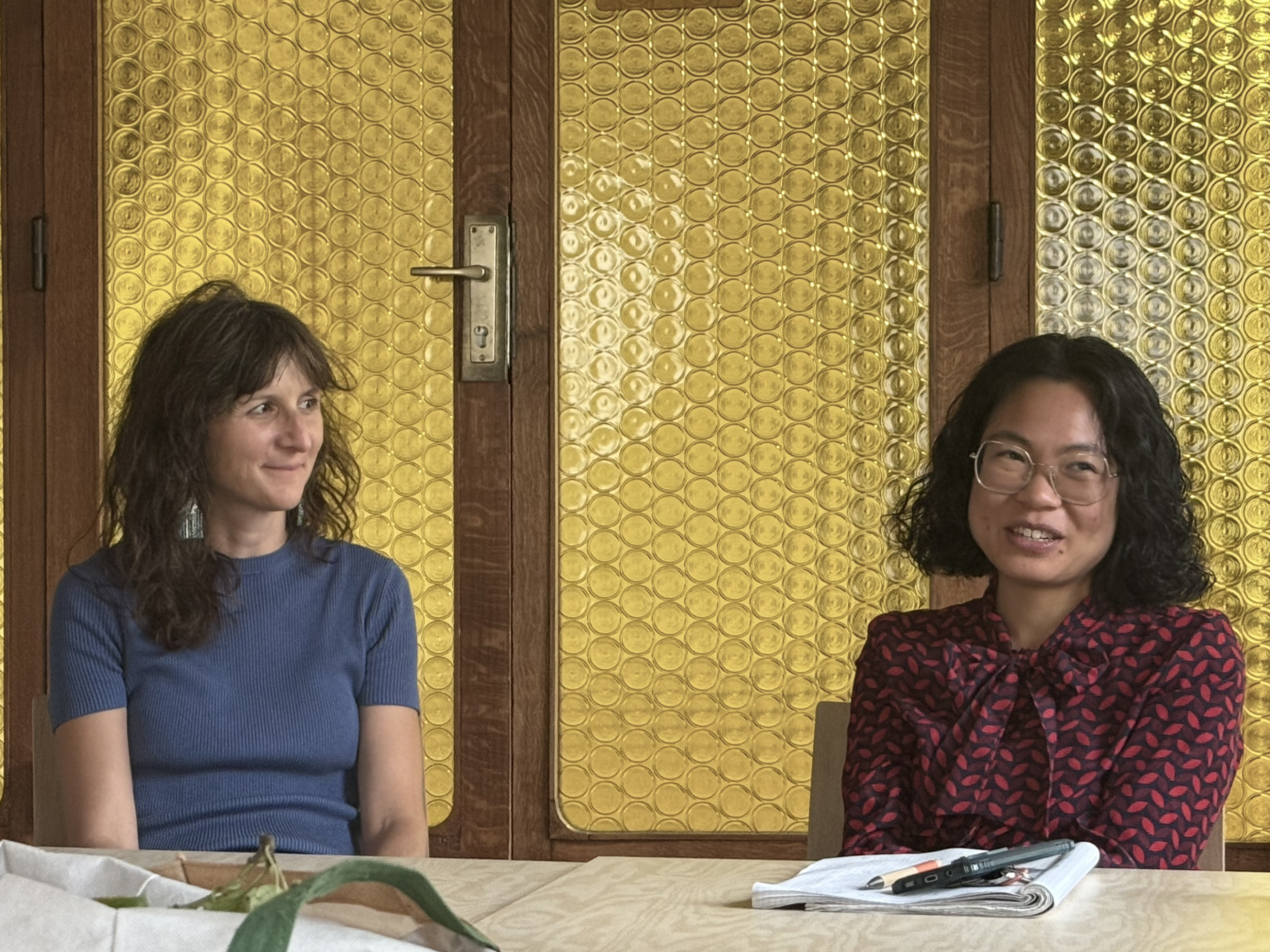 Two participants in conversation at the September meetup.
