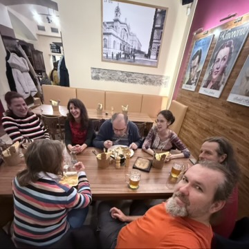 A Christmas meetup around a restaurant table.